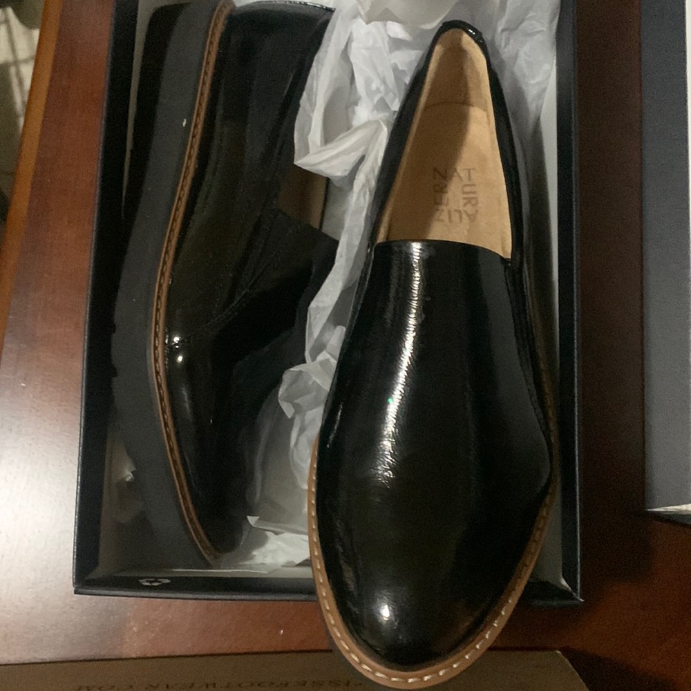 Black patent leather slip on shoes